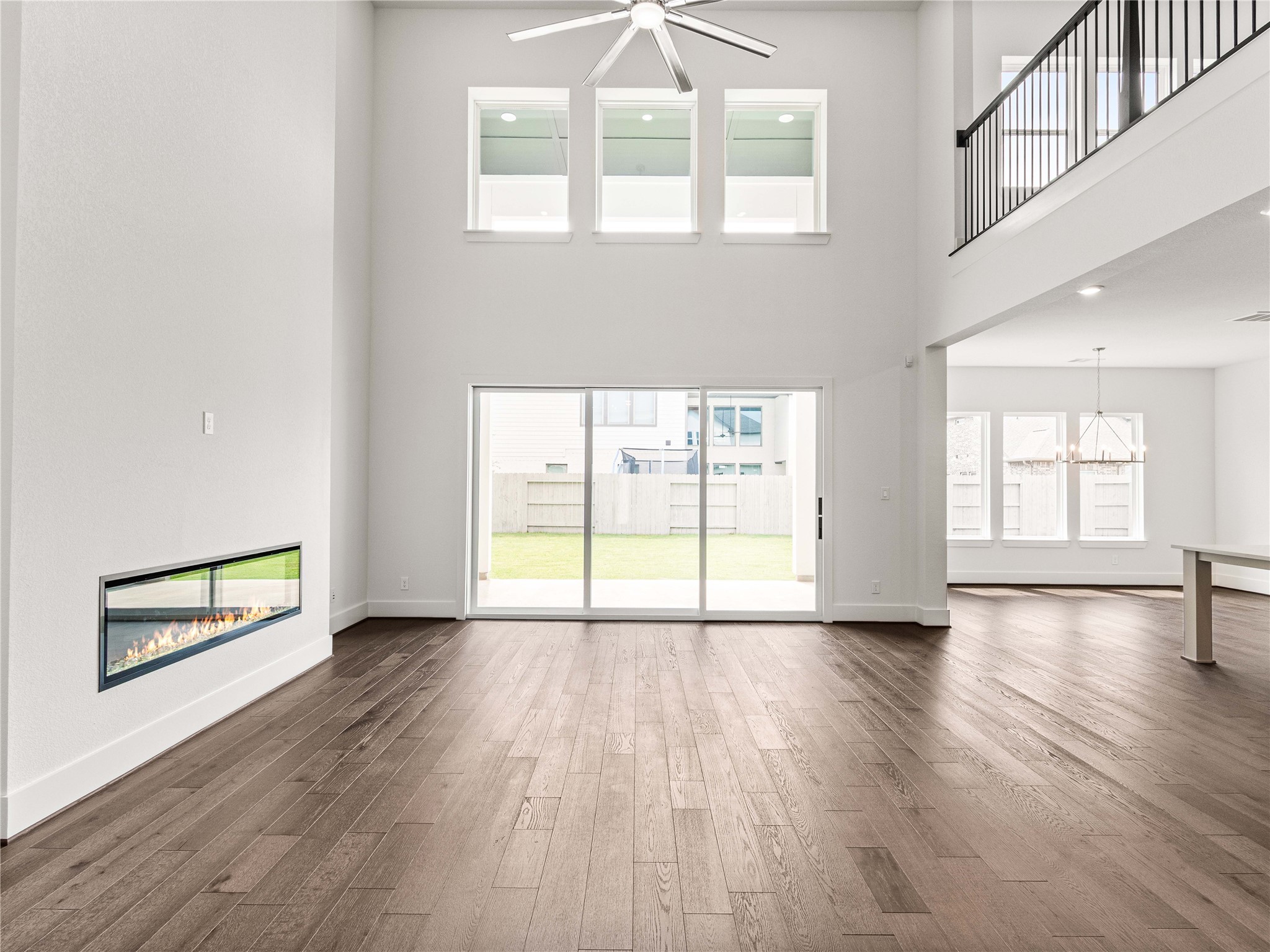 4926 Grapevine Lane Manvel, TX 77578 - Photo 5 of 41 an empty room with wooden floor and windows