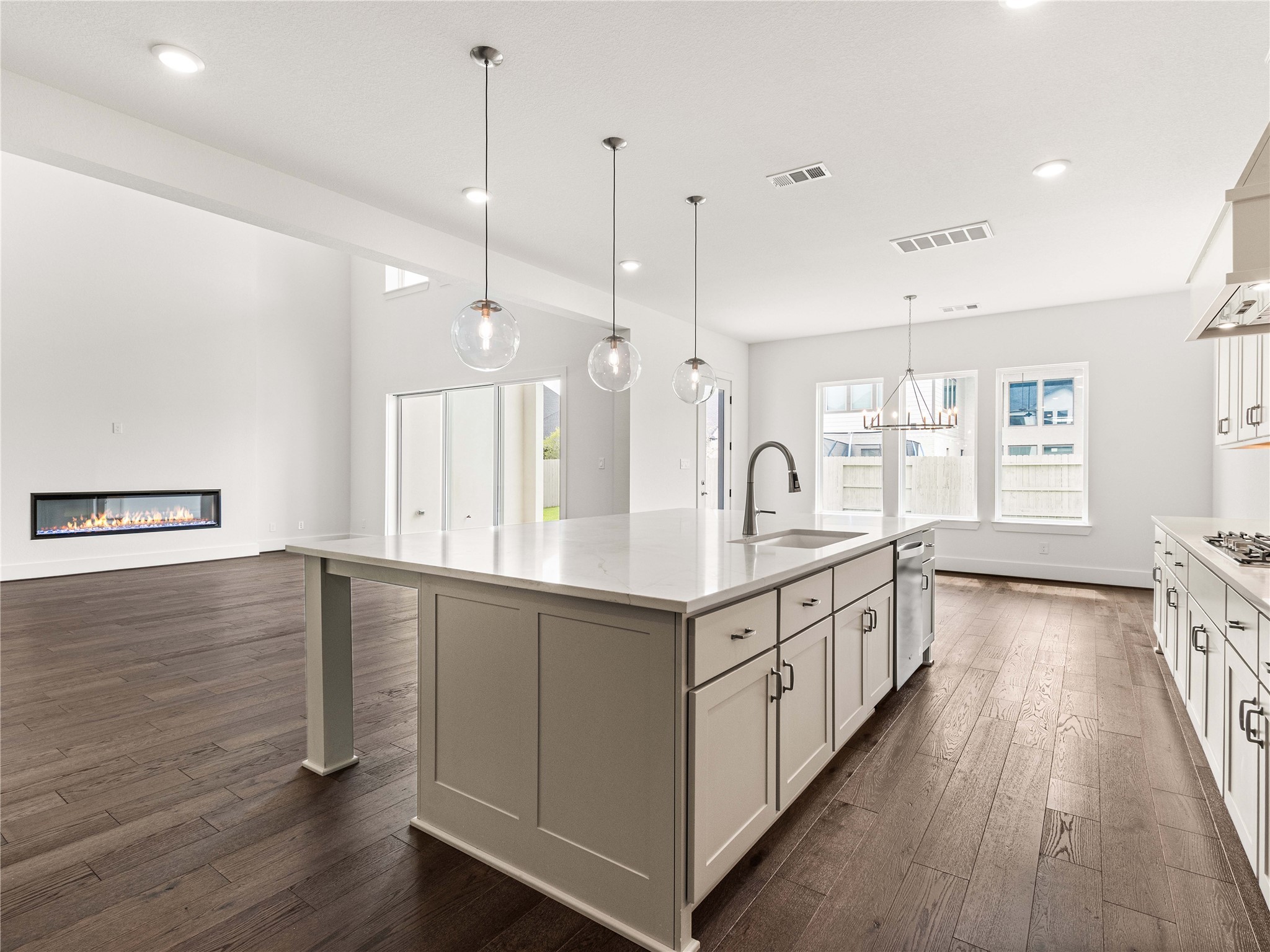 4926 Grapevine Lane Manvel, TX 77578 - Photo 7 of 41 a large kitchen with granite countertop lots of counter space and a sink