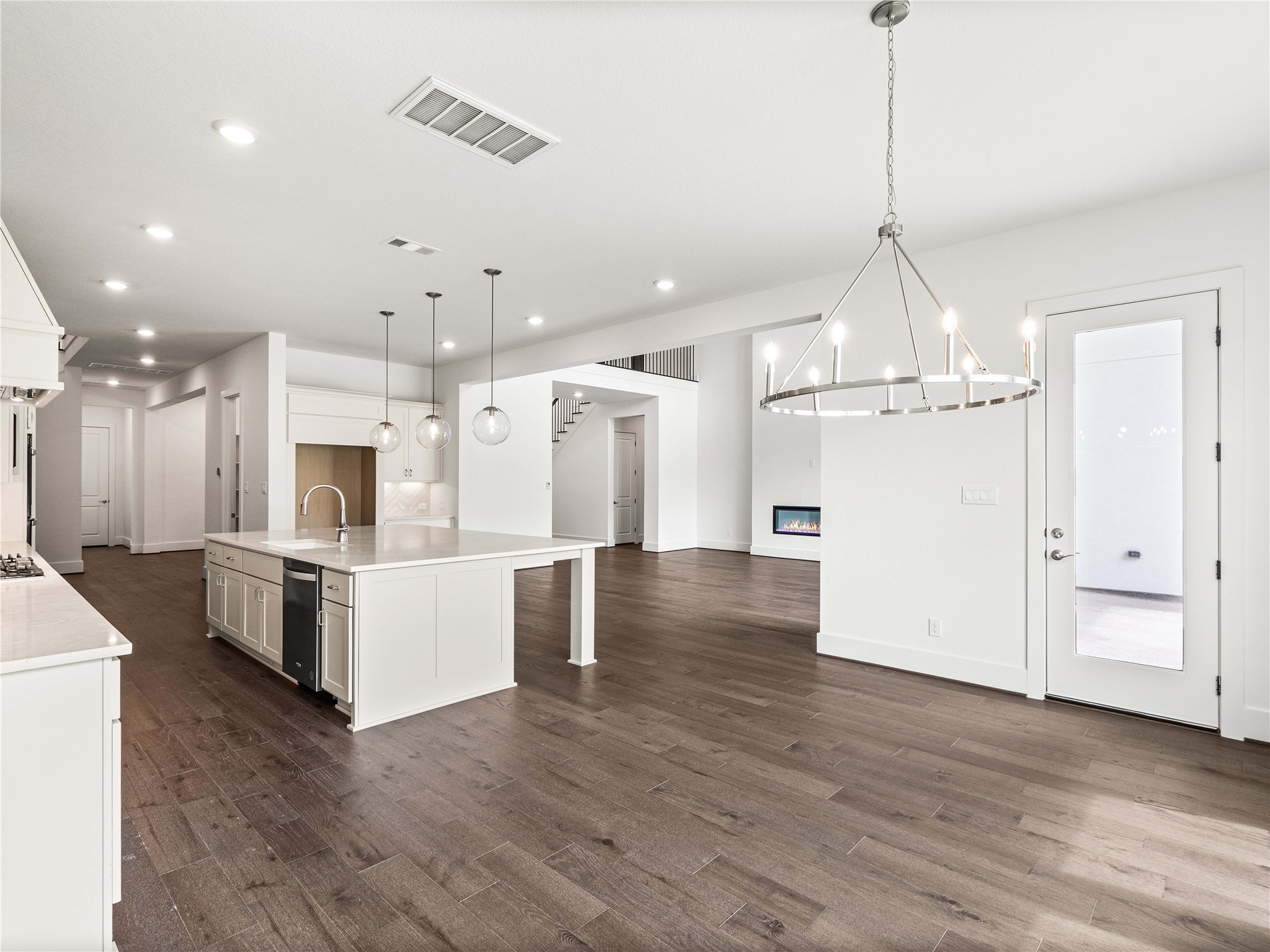 4926 Grapevine Lane Manvel, TX 77578 - Photo 10 of 41 a view of a kitchen with refrigerator and wooden floor