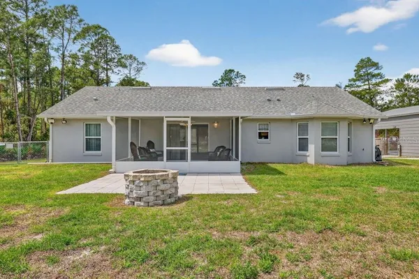 a house with trees in the background