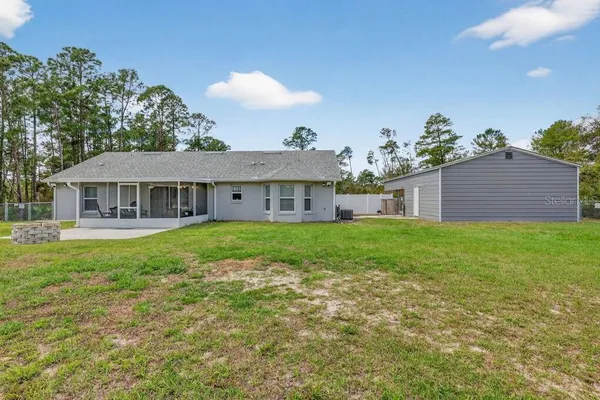 a view of a backyard with pathway