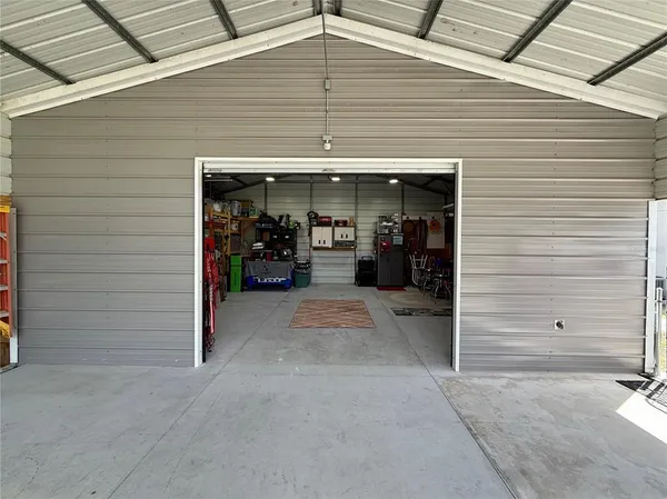 a view of a water heater and a garage
