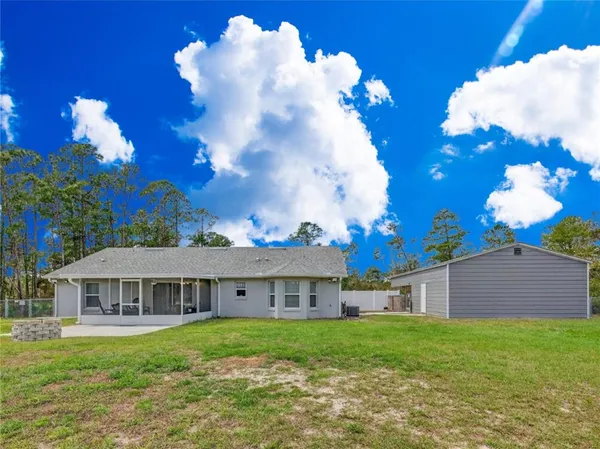 a view of a house with a garden