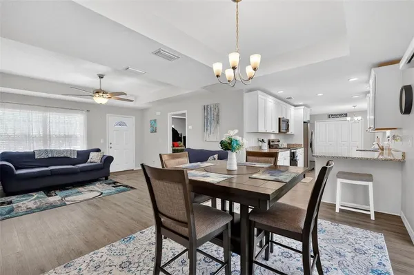 a view of a dining room with furniture and wooden floor