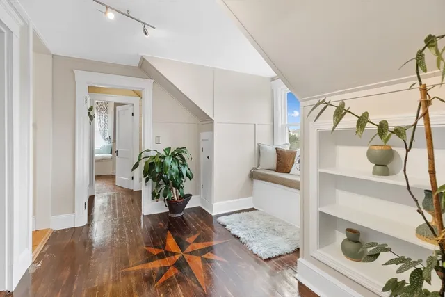 a living room with a furniture and a window