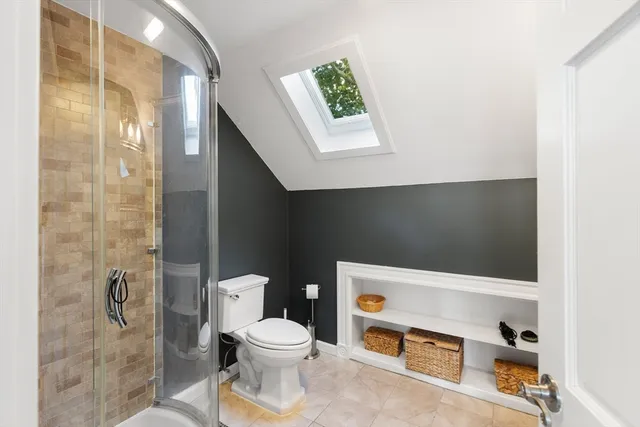 a view of a bedroom with wooden floor