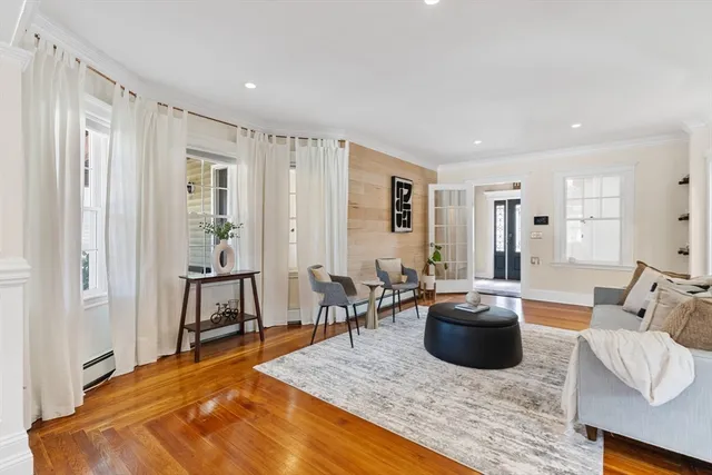 a living room with furniture rug and window