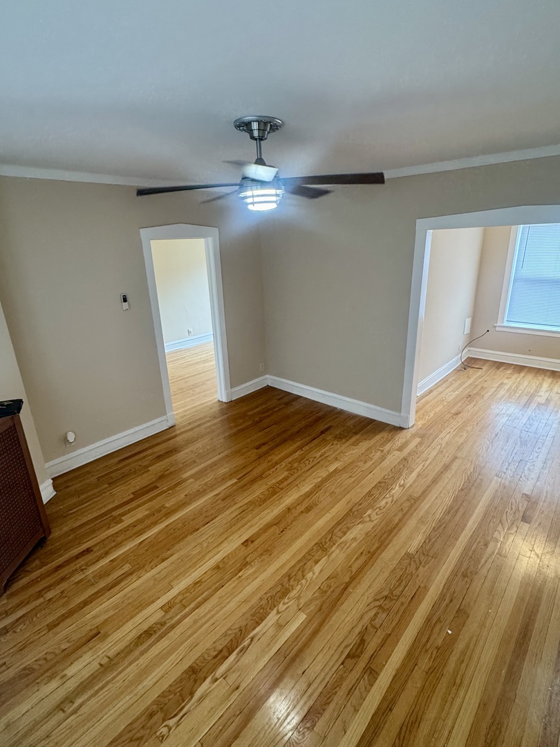 6638 South Greenwood Avenue, Unit 2B Chicago, IL 60637 - Photo 4 of 23 a view of empty room with wooden floor