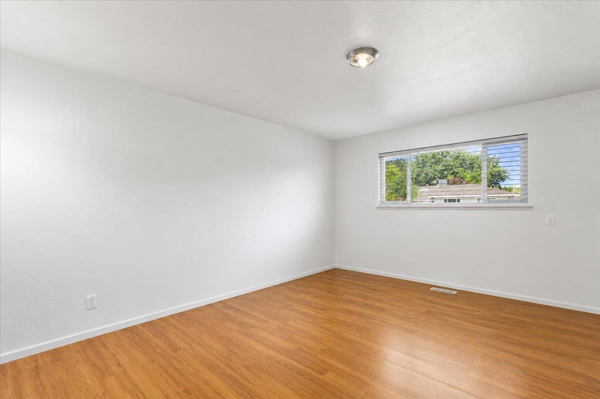 69 Springbrook Circle Sacramento, CA 95831 - Photo 19 of 29 a view of empty room with wooden floor and fan
