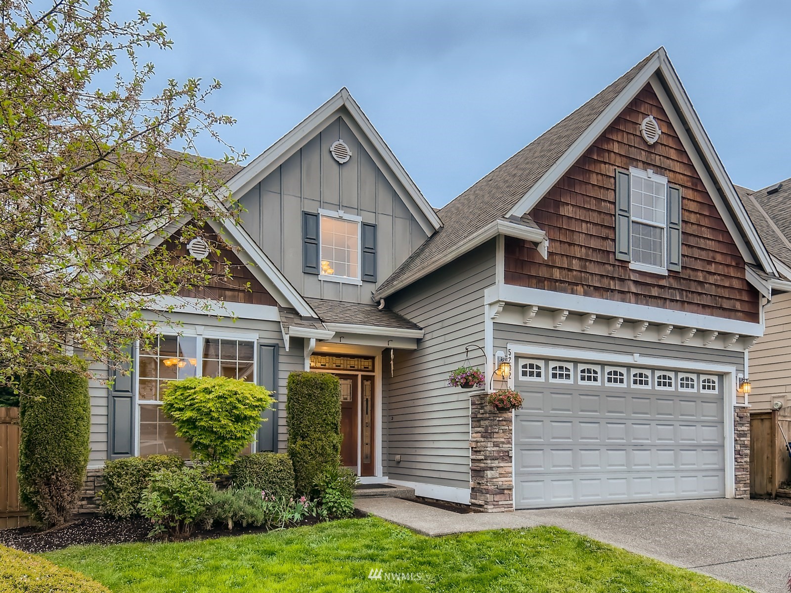5232 Northeast 3rd Place Renton, WA 98059 - Photo 1 of 28 a front view of a house with a yard