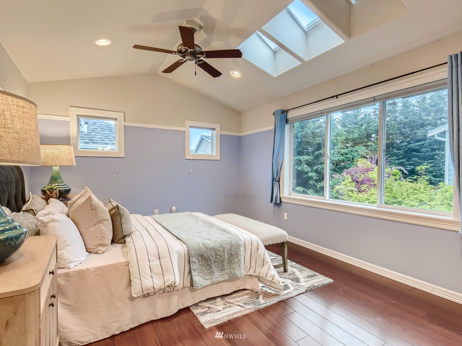 5232 Northeast 3rd Place Renton, WA 98059 - Photo 13 of 28 a bedroom with a bed and a large window