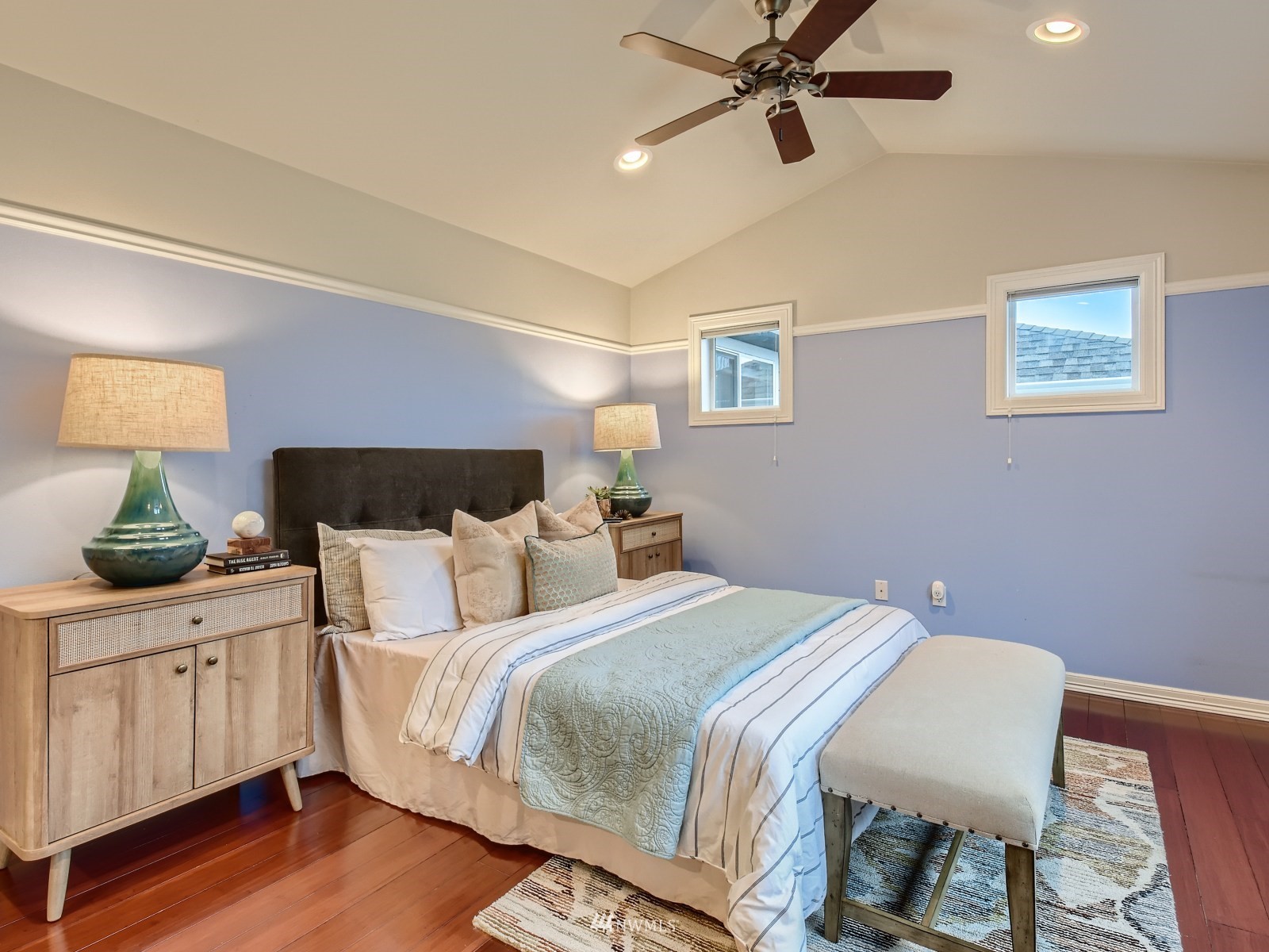 5232 Northeast 3rd Place Renton, WA 98059 - Photo 14 of 28 a bedroom with a bed and wooden floor