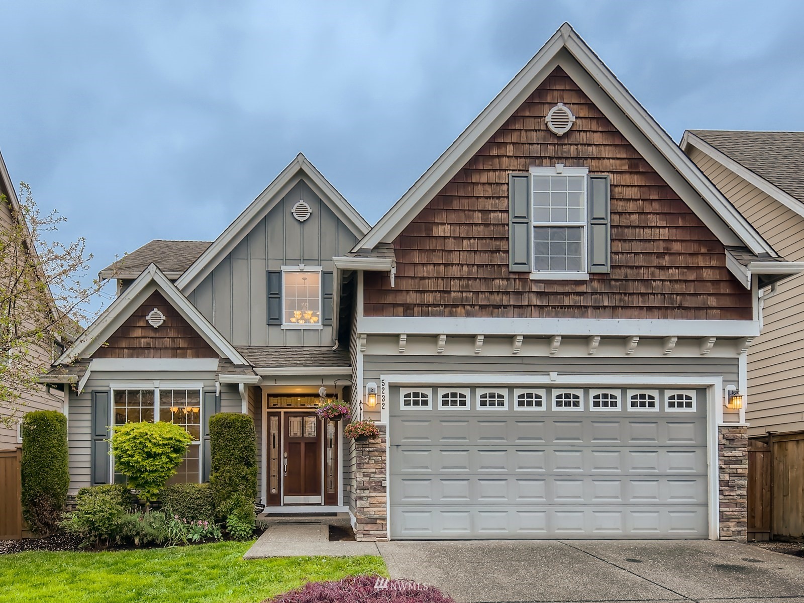 5232 Northeast 3rd Place Renton, WA 98059 - Photo 2 of 28 a front view of a house with a yard