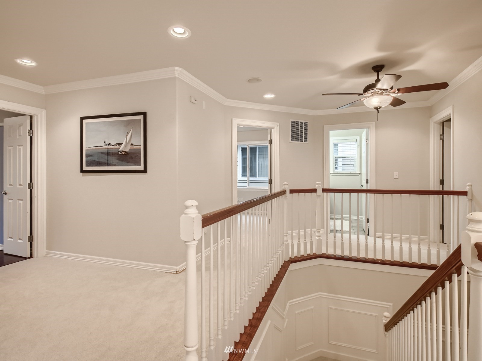 5232 Northeast 3rd Place Renton, WA 98059 - Photo 23 of 28 a view of staircase with white walls and window