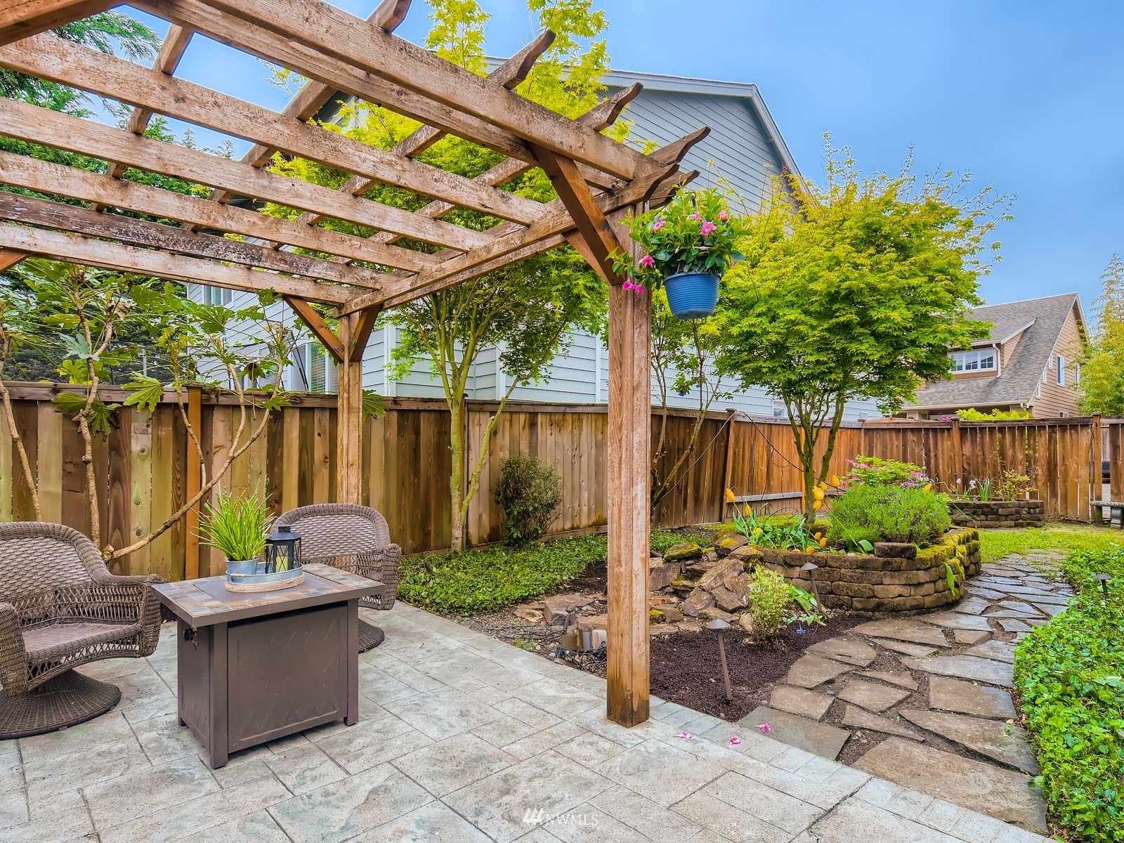 5232 Northeast 3rd Place Renton, WA 98059 - Photo 26 of 28 a backyard of a house with lots of green space and furniture