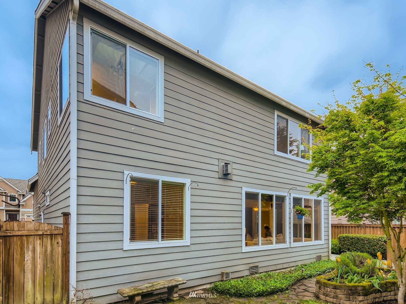 5232 Northeast 3rd Place Renton, WA 98059 - Photo 28 of 28 a view of a house with more windows and flower plants