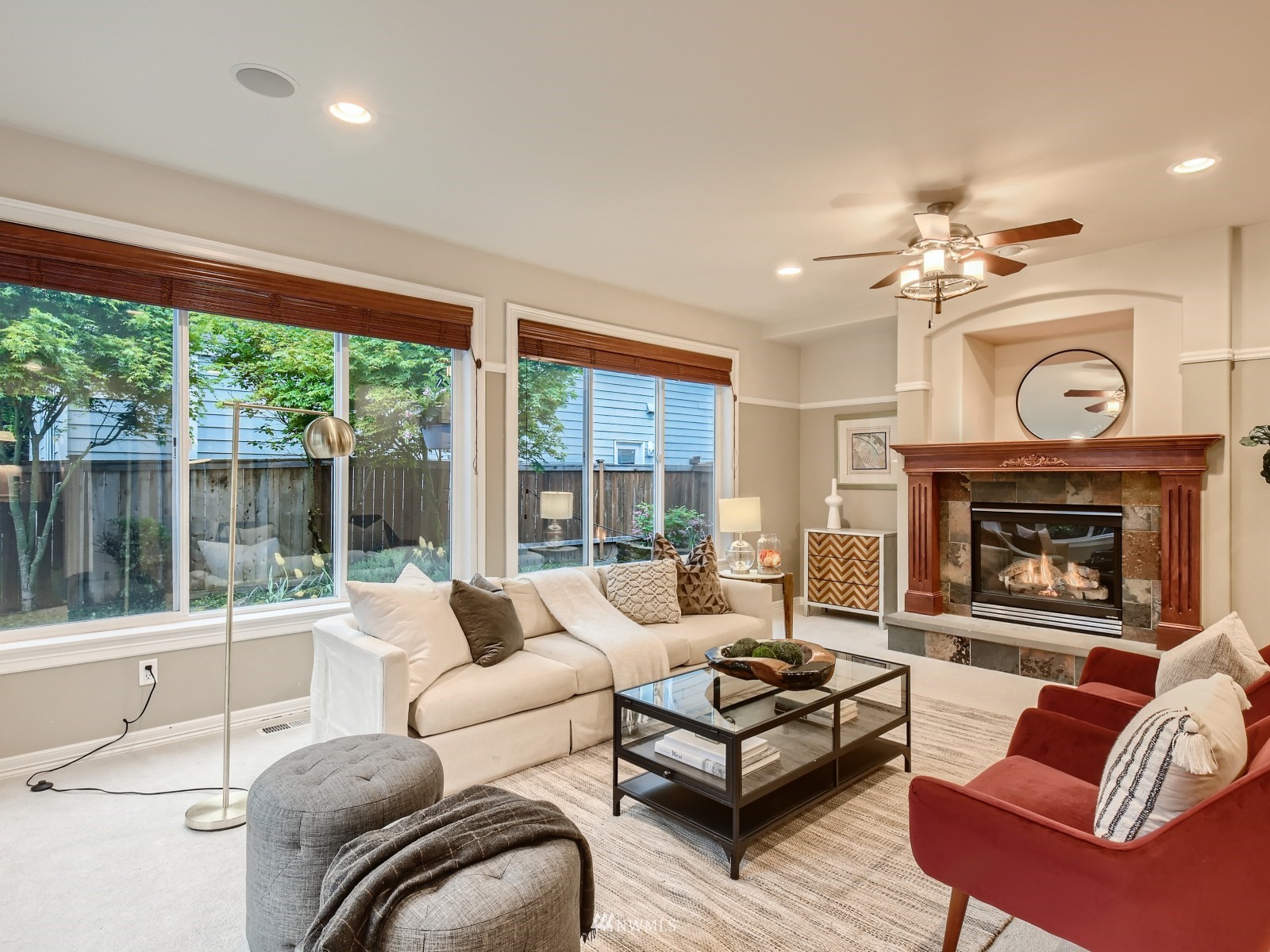 5232 Northeast 3rd Place Renton, WA 98059 - Photo 5 of 28 a living room with furniture a fireplace and a large window
