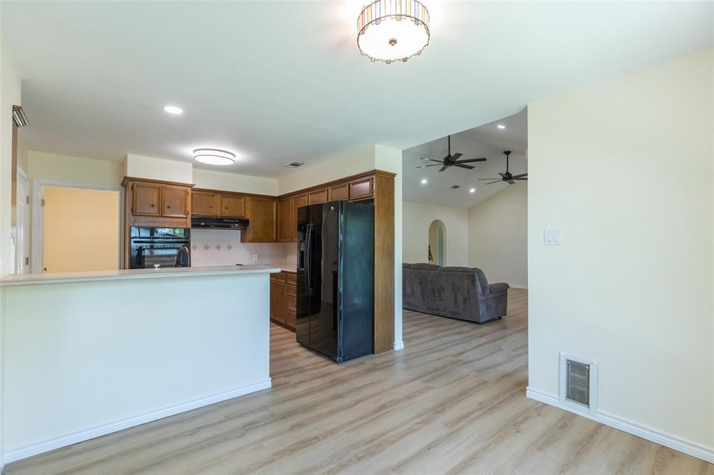 40 Carriage Road Abilene, TX 79605 - Photo 11 of 40 a view of kitchen with stainless steel appliances a refrigerator and wooden floor