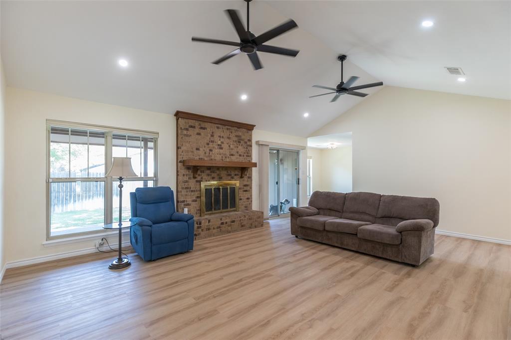 40 Carriage Road Abilene, TX 79605 - Photo 16 of 40 a living room with furniture and a fireplace