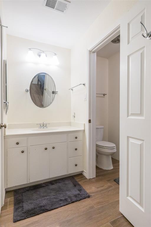 40 Carriage Road Abilene, TX 79605 - Photo 20 of 40 a spacious bathroom with a toilet sink and mirror