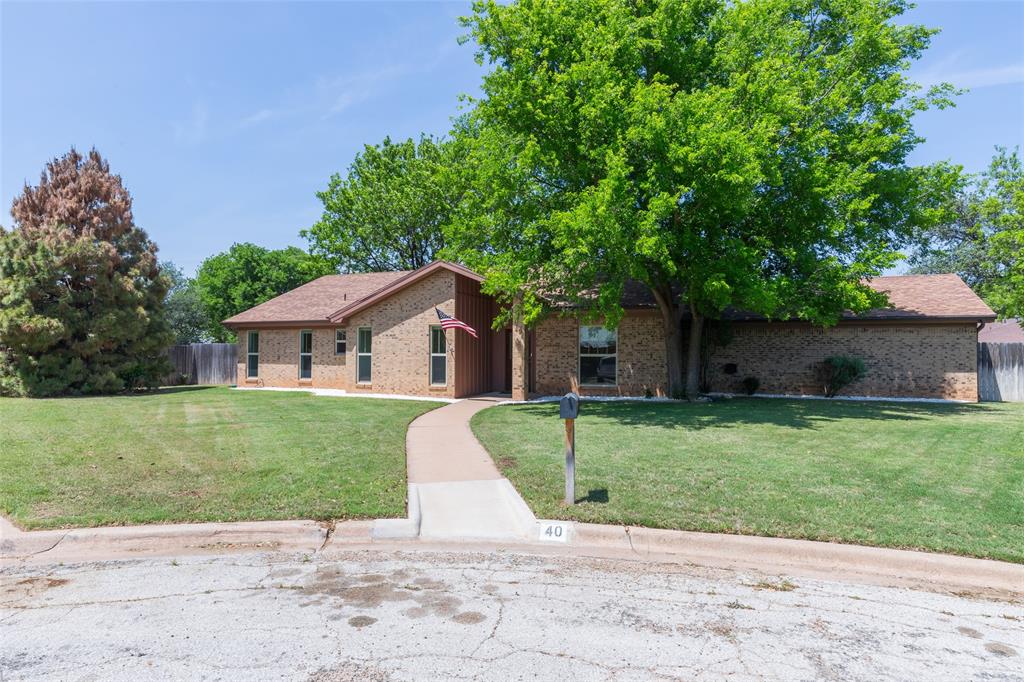 40 Carriage Road Abilene, TX 79605 - Photo 2 of 40 a front view of a house with a yard and garage