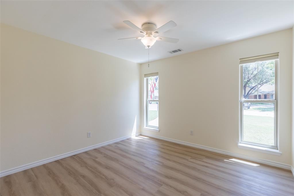 40 Carriage Road Abilene, TX 79605 - Photo 27 of 40 a view of an empty room with wooden floor and a window