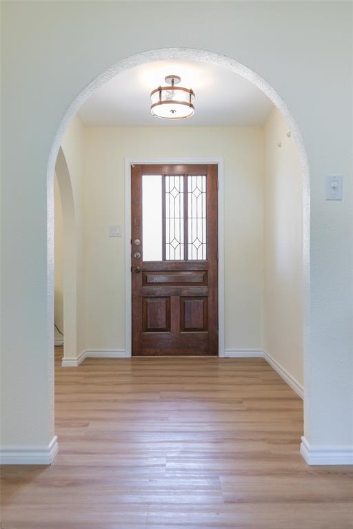40 Carriage Road Abilene, TX 79605 - Photo 3 of 40 a view of an empty room with wooden floor and a window
