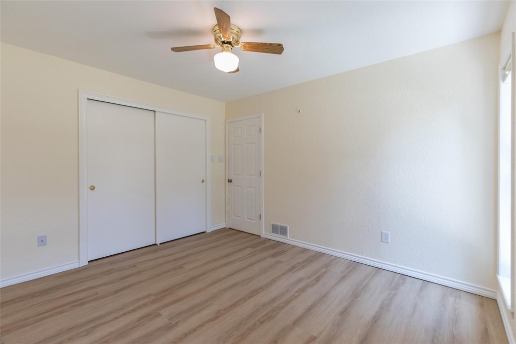 40 Carriage Road Abilene, TX 79605 - Photo 32 of 40 an empty room with wooden floor fan and window