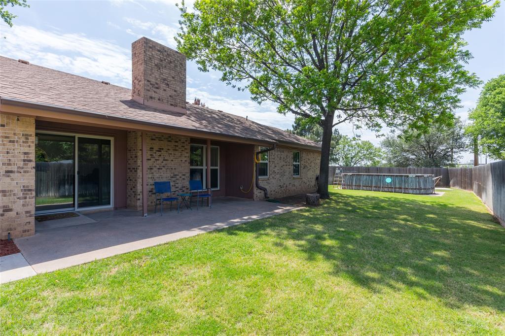 40 Carriage Road Abilene, TX 79605 - Photo 34 of 40 a view of a house with backyard and a tree