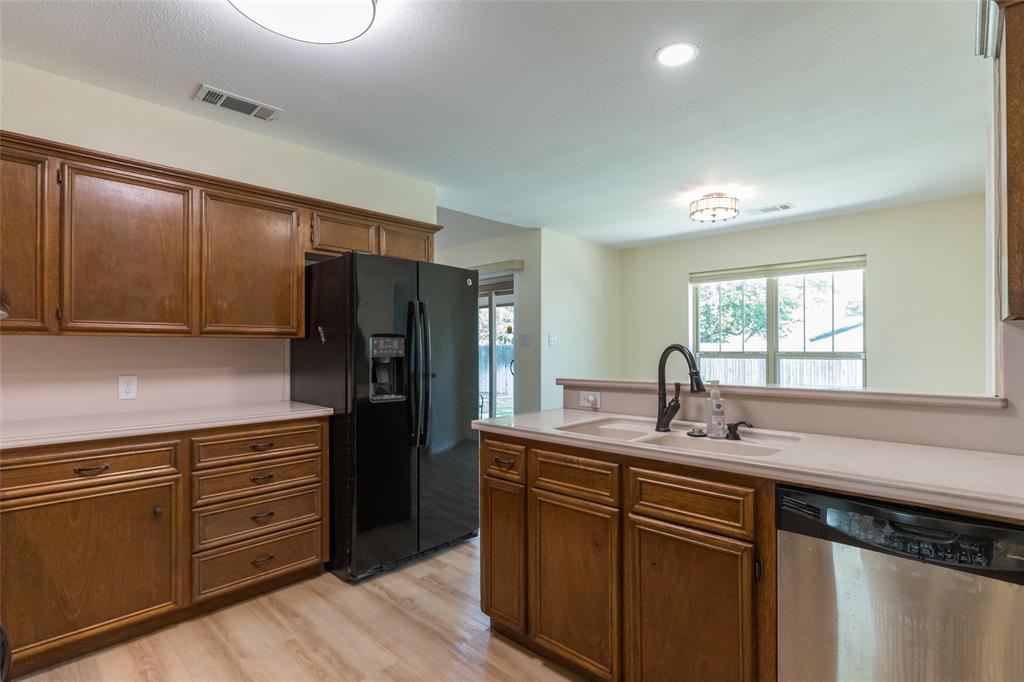 40 Carriage Road Abilene, TX 79605 - Photo 7 of 40 a kitchen with stainless steel appliances granite countertop a sink stove and refrigerator