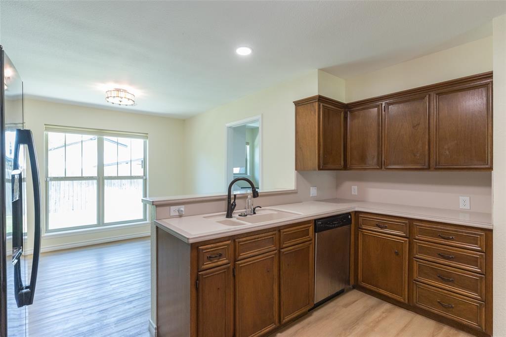 40 Carriage Road Abilene, TX 79605 - Photo 8 of 40 a kitchen with a sink cabinets and wooden floor