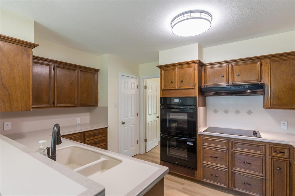 40 Carriage Road Abilene, TX 79605 - Photo 9 of 40 a kitchen with stainless steel appliances granite countertop a sink stove and refrigerator