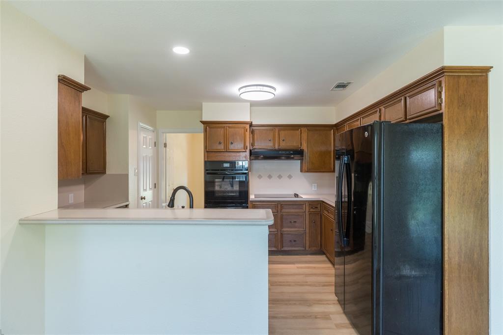 40 Carriage Road Abilene, TX 79605 - Photo 10 of 40 a kitchen with stainless steel appliances granite countertop a refrigerator and a sink