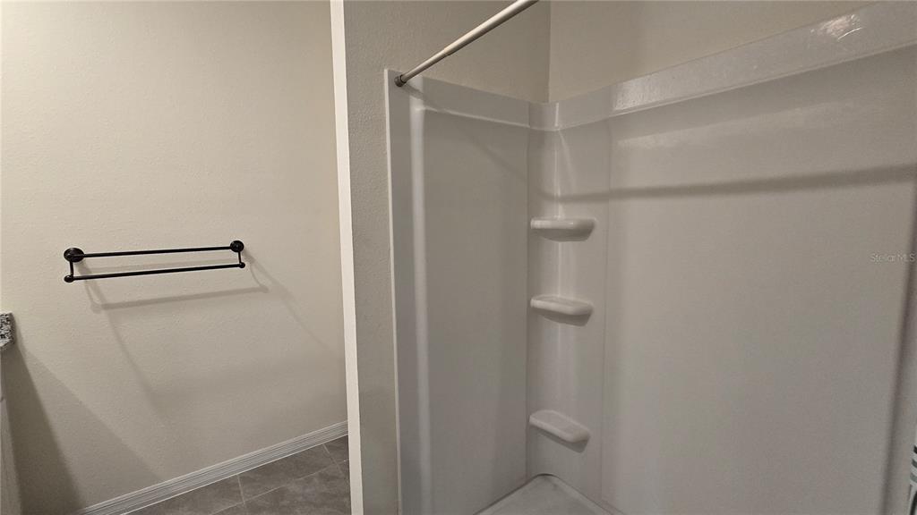 1784 Bull Hl Road Kissimmee, FL 34744 - Photo 19 of 33 a bathroom with a shower