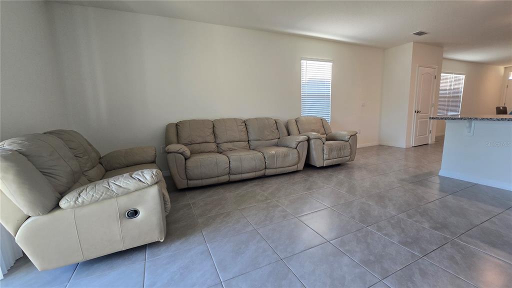 1784 Bull Hl Road Kissimmee, FL 34744 - Photo 21 of 33 a living room with furniture and a window