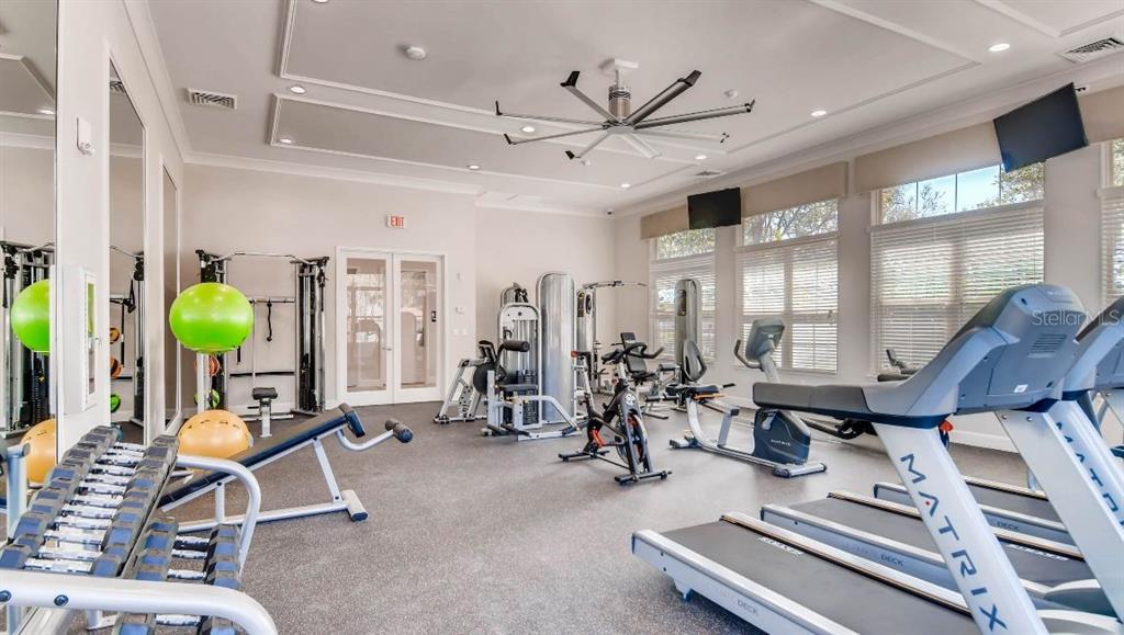 1784 Bull Hl Road Kissimmee, FL 34744 - Photo 29 of 33 a room with gym equipment and a view of living room
