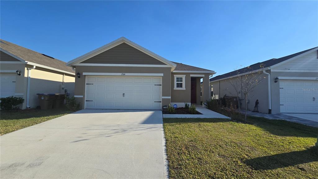 1784 Bull Hl Road Kissimmee, FL 34744 - Photo 3 of 33 a front view of a house with garden