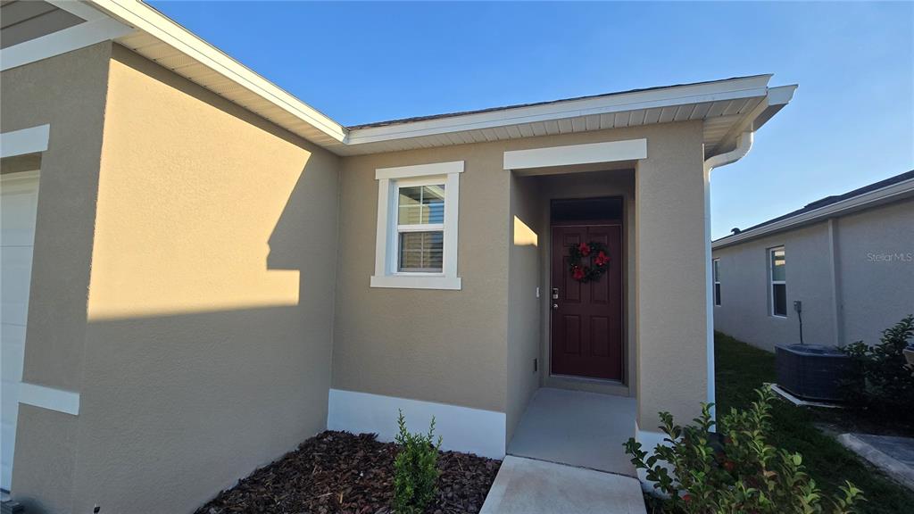 1784 Bull Hl Road Kissimmee, FL 34744 - Photo 4 of 33 a view of a house with backyard and porch
