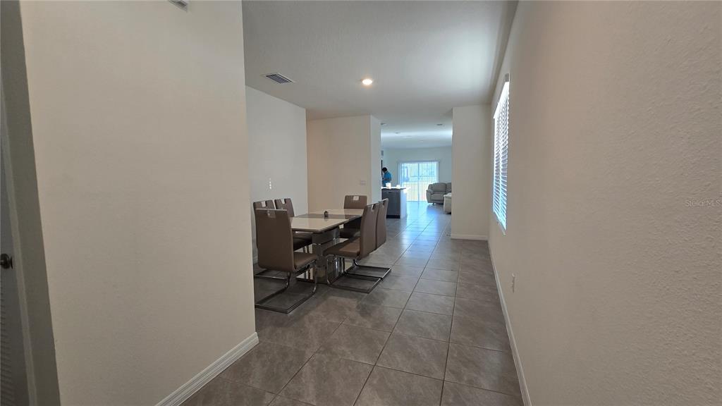 1784 Bull Hl Road Kissimmee, FL 34744 - Photo 5 of 33 a living room with furniture and a potted plant