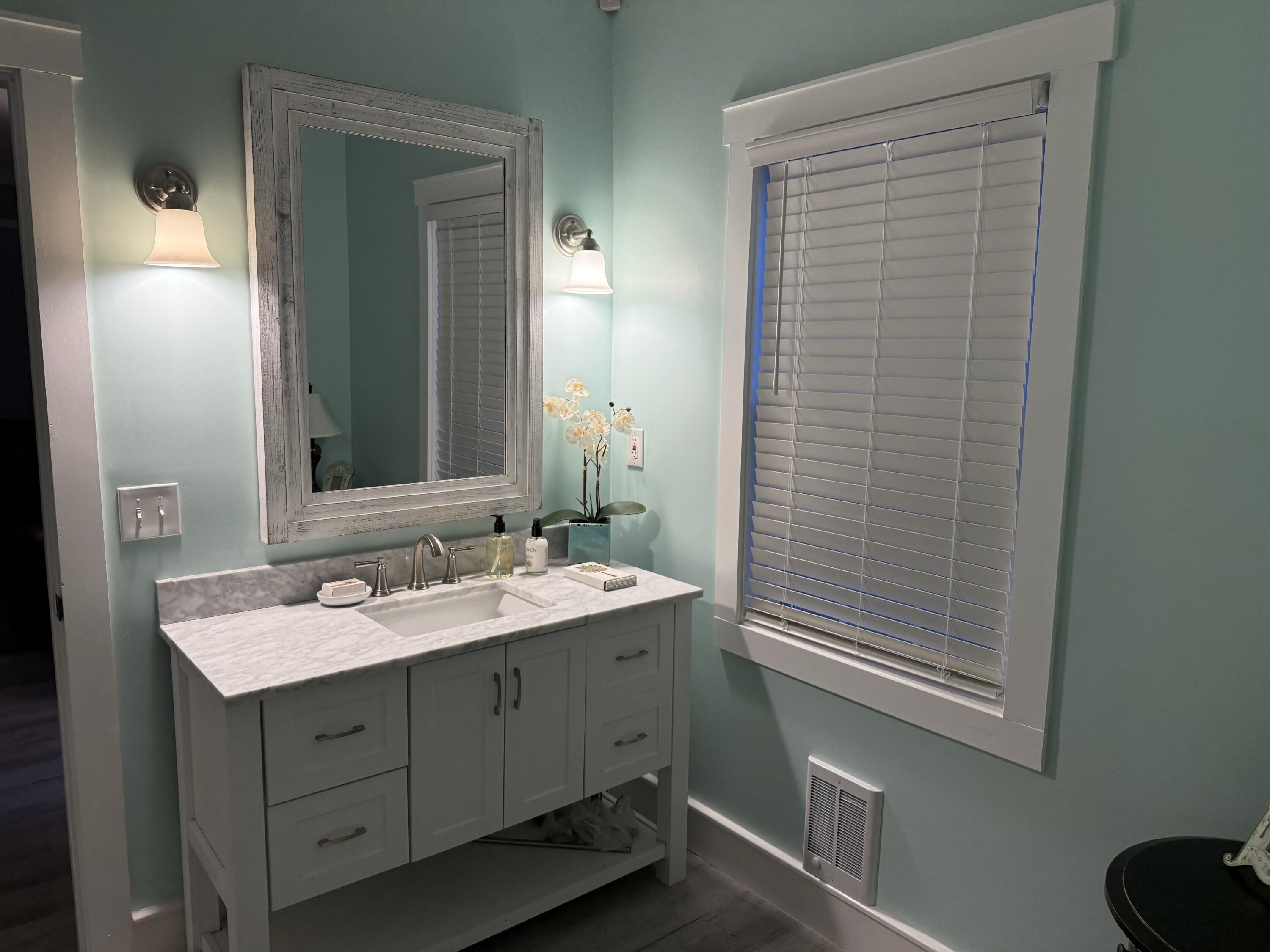 357 North Windsor Road Windsor, SC 29856 - Photo 8 of 20 a bathroom with a sink and a mirror