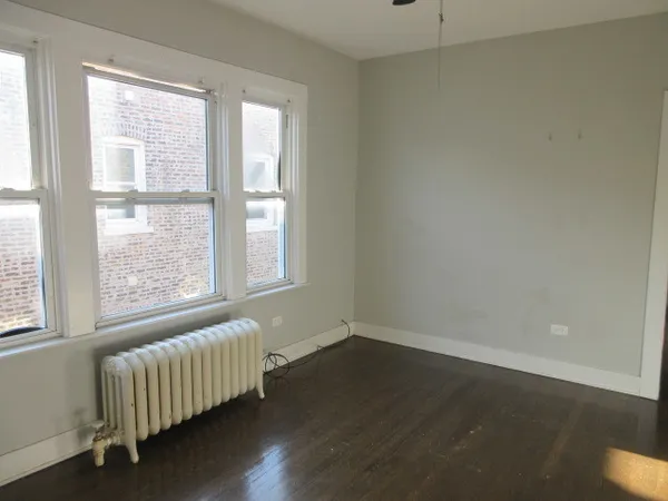 a room with a bed and a window