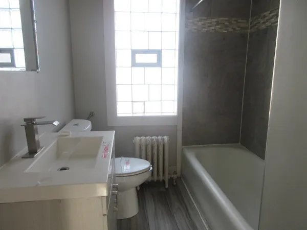 a bathroom with a sink and toilet