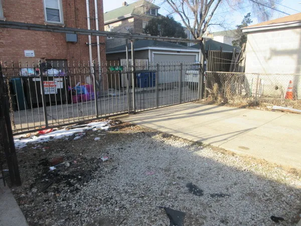 a view of entrance gate of a house