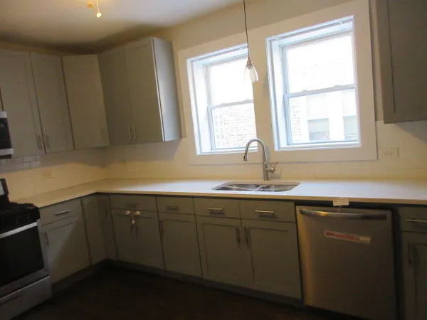 a kitchen with a sink and window