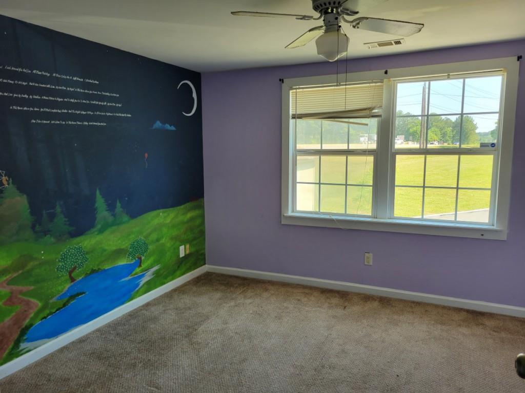 7217 Union Grove Road Lithonia, GA 30058 - Photo 7 of 12 a view of an empty room with a window