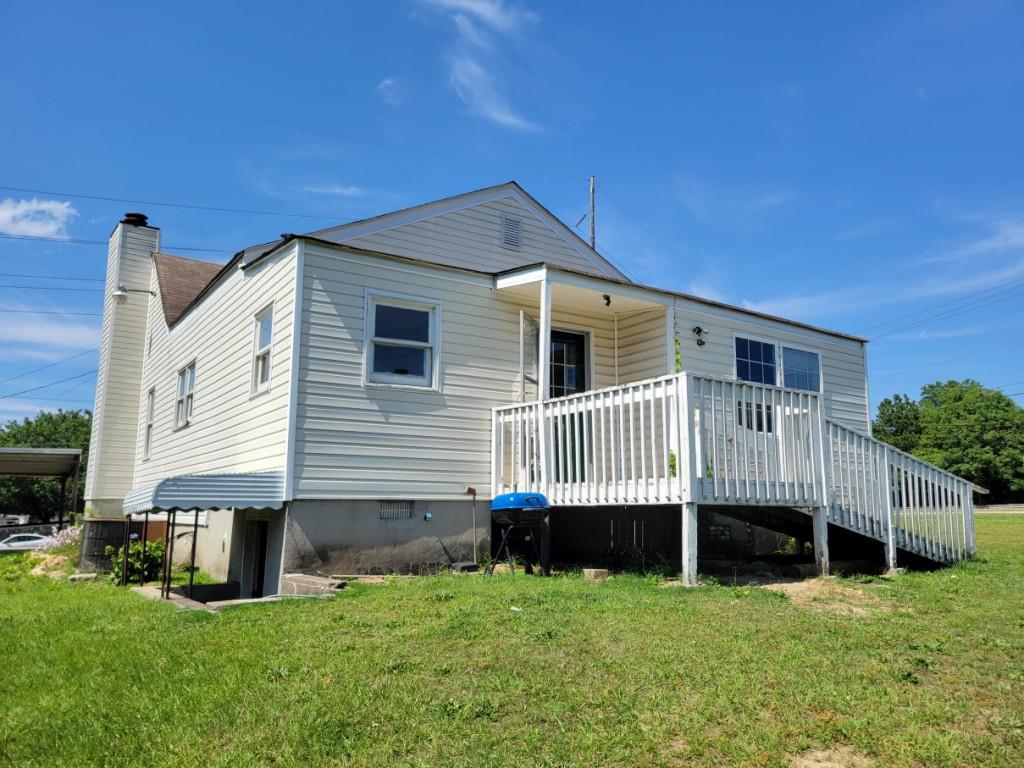 7217 Union Grove Road Lithonia, GA 30058 - Photo 10 of 12 a view of a house with a backyard