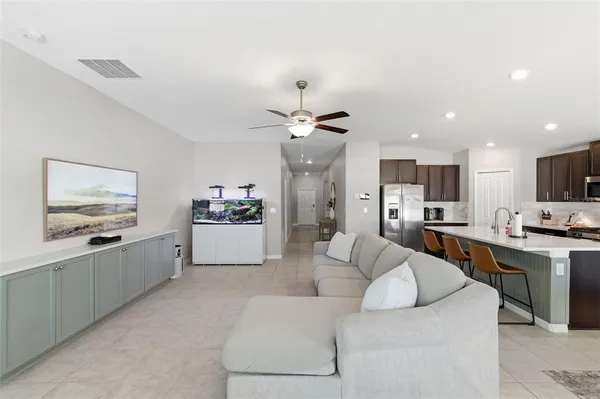 a bed room with a bed and a ceiling fan