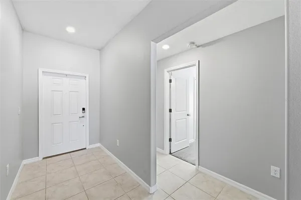 a bedroom with a bed and a ceiling fan