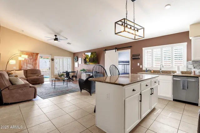 a very nice looking living room with a chandelier