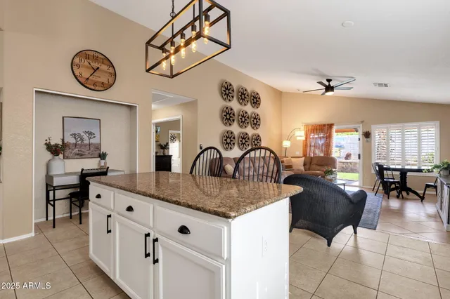 a kitchen with cabinets and stainless steel appliances